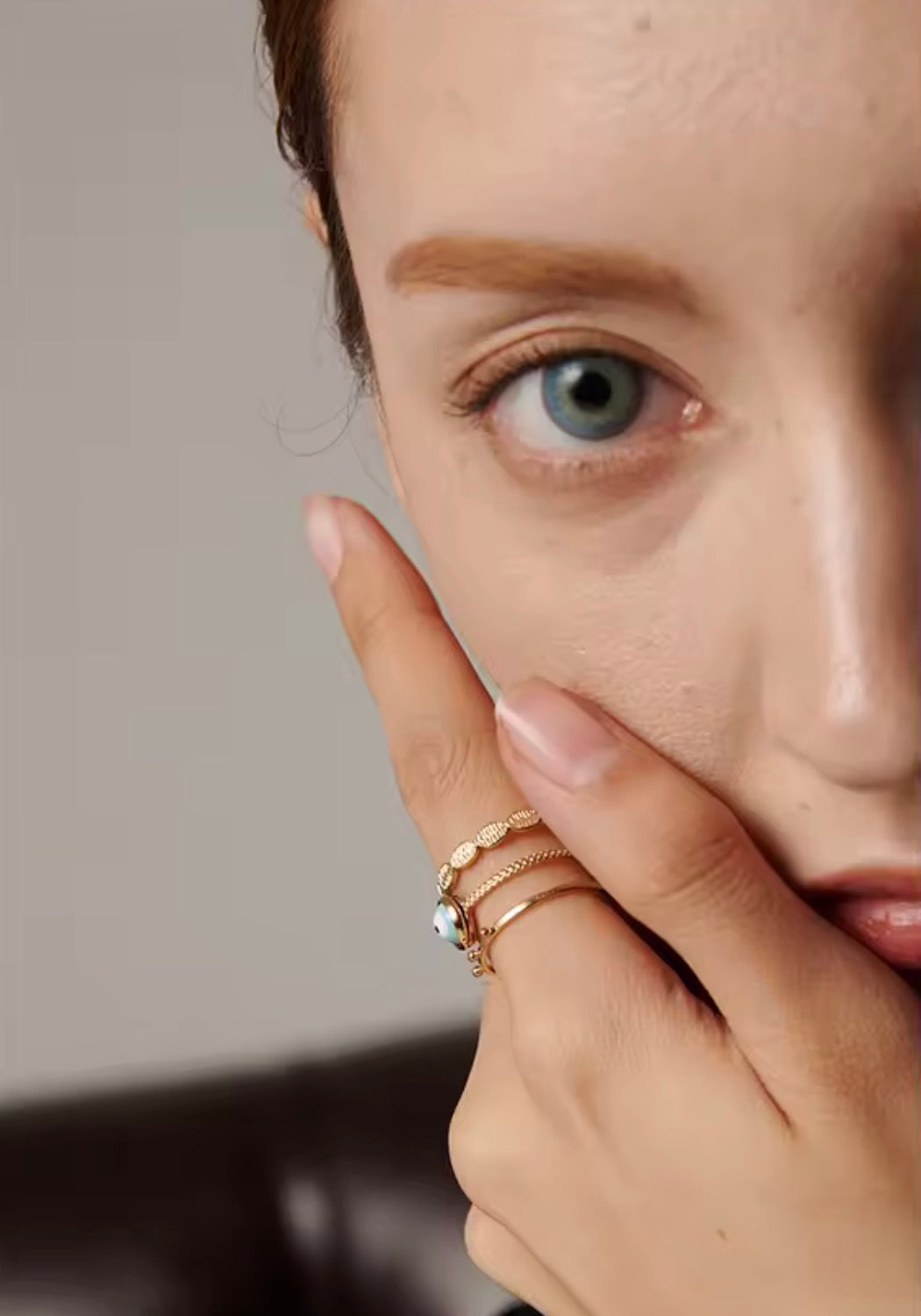 Close-up of Evil Eye 3-Layer Ring worn on finger — turquoise evil eye stone and layered gold band detail