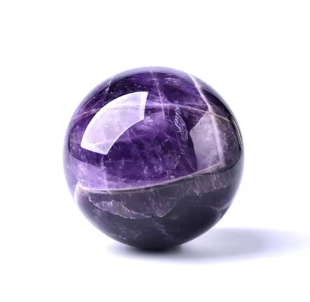 Natural amethyst crystal globe sphere showing deep violet colour and white veining